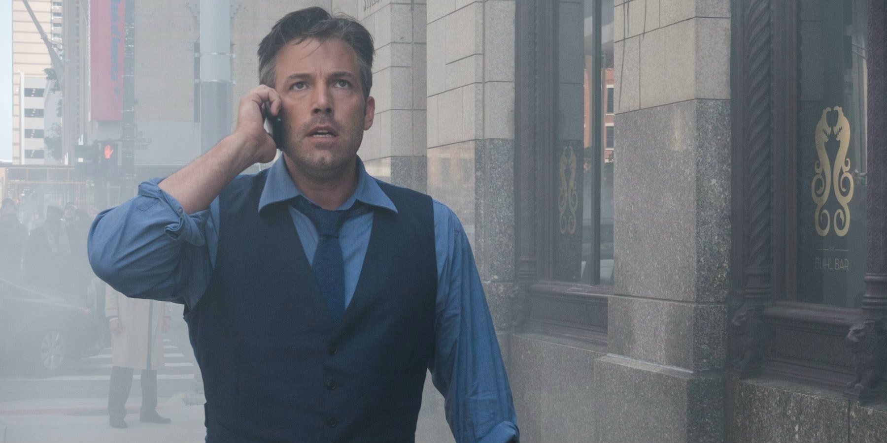 Bruce runs through Metropolis in Batman v Superman