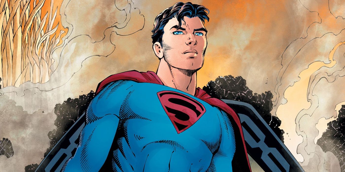 Young Superman stands amidst burning debris