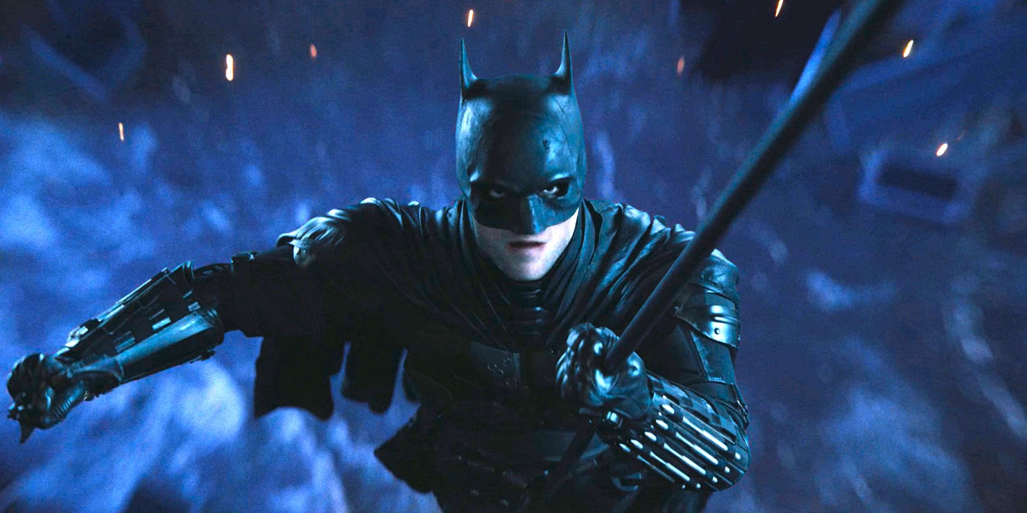 The Batman 2022 Robert Pattinson as Batman flying through the air on his grappling hook