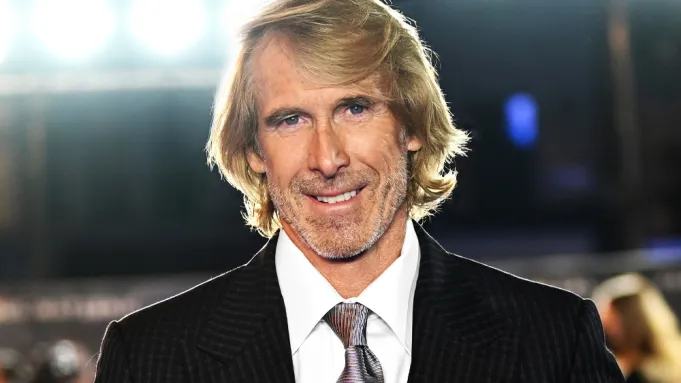 Michael Bay in an event wearing white shirt with black coat or jacket.