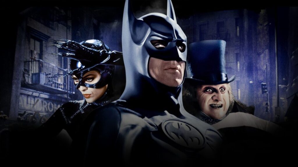 Tim Burton’s Batman and Batman Returns characters – Michael Keaton as Batman, Michelle Pfeiffer as Catwoman, Danny DeVito as Penguin, Jack Nicholson’s Joker — official poster for August 25 Dolby Cinema re-release at AMC, classic DC superhero movies.