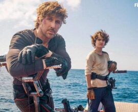 Ryan Gosling in the first official look from Star Wars: Starfighter (2027), standing alongside Flynn Gray in a futuristic starfighter setting.