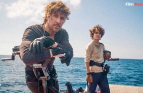 Ryan Gosling in the first official look from Star Wars: Starfighter (2027), standing alongside Flynn Gray in a futuristic starfighter setting.