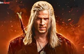 First official look at Liam Hemsworth as Geralt of Rivia in The Witcher Season 4, wearing Geralt’s iconic armor and holding a sword.