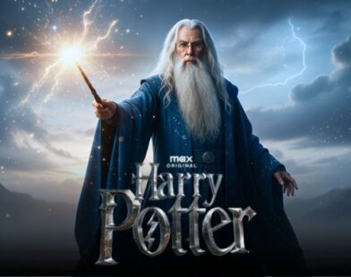 John Lithgow as Dumbledore standing on a misty shore, wearing a blue robe and casting a spell over the water in the new Harry Potter series