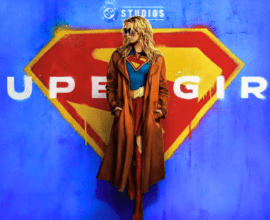 Milly Alcock as Supergirl and David Corenswet as Superman standing side by side on a Metropolis rooftop, showcasing the new DCU costumes