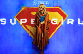 Milly Alcock as Supergirl and David Corenswet as Superman standing side by side on a Metropolis rooftop, showcasing the new DCU costumes