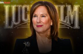 Kathleen Kennedy standing in front of a Lucasfilm or Star Wars backdrop during a media event.