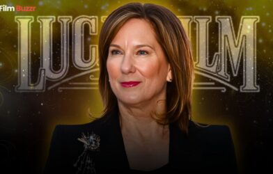 Kathleen Kennedy standing in front of a Lucasfilm or Star Wars backdrop during a media event.