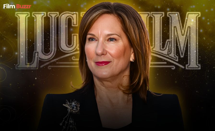 Kathleen Kennedy standing in front of a Lucasfilm or Star Wars backdrop during a media event.